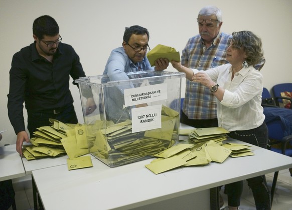 Officials count votes at a polling station, in Ankara, Turkey, Sunday, May 14, 2023. Election polls have closed Sunday in Turkey, where President Recep Tayyip Erdogan's leadership hung in the bal ...
