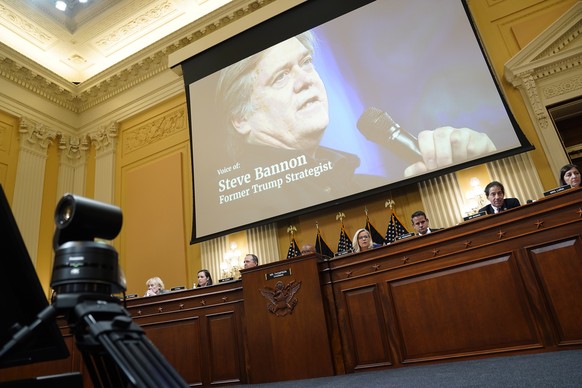 epa10025945 Former White House Chief Strategist Steve Bannon appears on a video screen during a public hearing of the House Select Committee to Investigate the January 6th Attack on the US Capitol, on ...