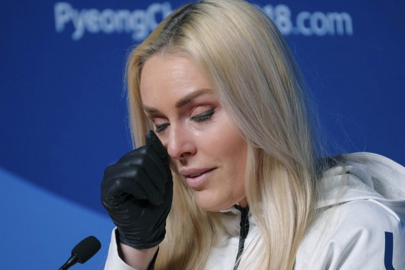 Alpine skier Lindsey Vonn, of the United States, wipes away a tear after answering a question about her grandfather during a press conference ahead of the 2018 Winter Olympics in Pyeongchang, South Korea, Friday, Feb. 9, 2018. (AP Photo/J. David Ake)
