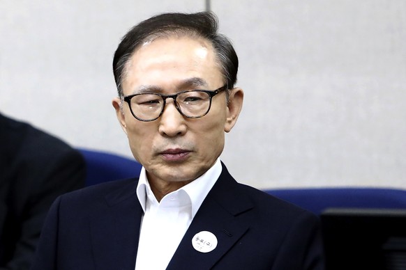 FILE - Former South Korean President Lee Myung-bak appears for his first trial at the Seoul Central District Court in Seoul, South Korea, March 23, 2018. The South Korean government of President Yoon  ...