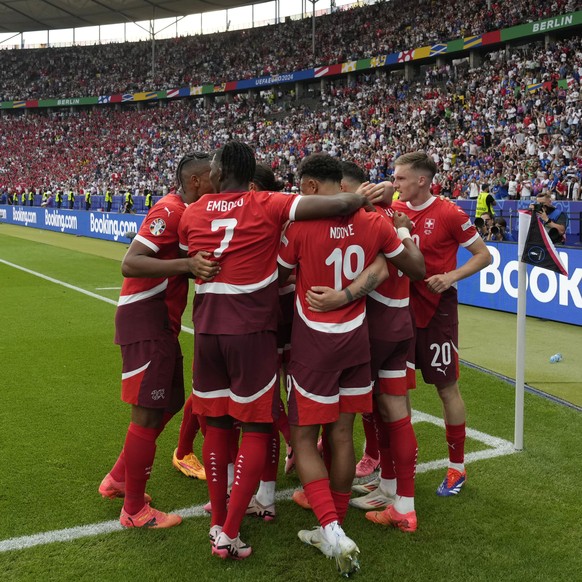 Switzerland players celebrate after Ruben Vargas scored his side&#039;s second goal during a round of sixteen match between Switzerland and Italy at the Euro 2024 soccer tournament in Berlin, Germany, ...