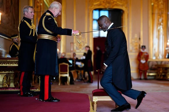 Idris Elba, Activist, Actor and Musician, right, is made a Knight Bachelor by Britain's King Charles III at Windsor Castle, Tuesday, June 2, 2026. (Jordan Pettitt/PA via AP)
Charles III,Idris Elb ...