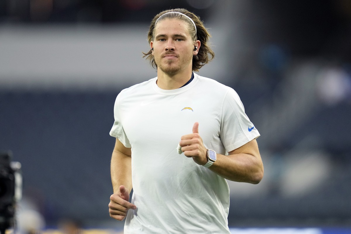 Los Angeles Chargers quarterback Justin Herbert warms up before an NFL football game against the Baltimore Ravens, Sunday, Nov. 26, 2023, in Inglewood, Calif. (AP Photo/Ashley Landis)