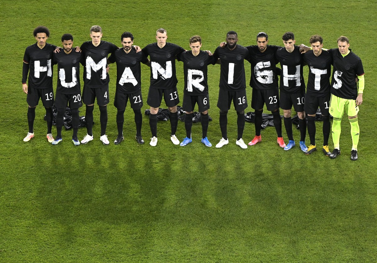 Germany's starting players pose for a team photo at the beginning of the World Cup 2022 group J qualifying soccer match between Germany and Iceland in Duisburg, Germany, Thursday, March 25, 2021. ...