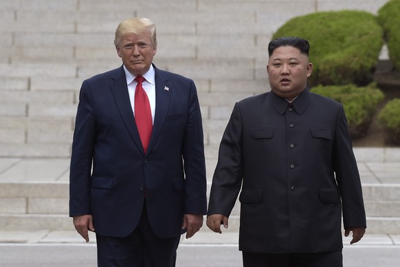 FILE - In this June 30, 2019, file photo, U.S. President Donald Trump, left, meets with North Korean leader Kim Jong Un at the North Korean side of the border at the village of Panmunjom in Demilitari ...