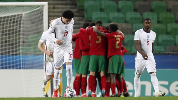 Portugal&#039;s Francisco Trincao celebrates with teammates after scoring his side&#039;s second goal from penalty during the Euro U21 group D soccer match between Portugal and England, at Stozice sta ...