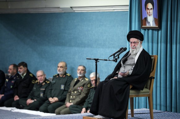 In this photo released by the official website of the office of the Iranian supreme leader, Supreme Leader Ayatollah Ali Khamenei speaks under a portrait of the late revolutionary founder Ayatollah Kh ...