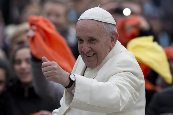Pope Francis gives the thumbs up as he arrives on his pope-mobile for his weekly general audience in St. Peter's Square at the Vatican, Wednesday, Feb. 12, 2014. (AP Photo/Alessandra Tarantino)