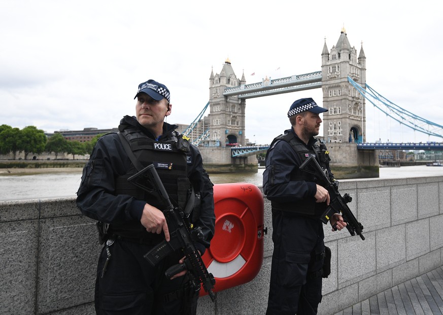 epa06369453 (FILE) - British police on dutyl during a vigil for the victims of the London Bridge terror attacks by the City Hall in London, Britain, 05 June 2017, (reissued 05 December 2017). Media re ...