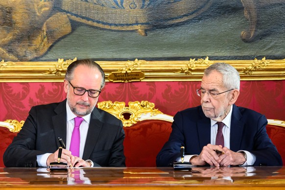 epa11816561 Austrian President Alexander Van der Bellen (R) and Foreign Minister Alexander Schallenberg (L) during a swearing-in ceremony for Schallenberg&#039;s appointment as caretaker Chancellor at ...