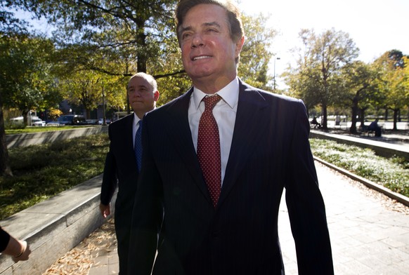 FILE - In this Nov. 2, 2017, file photo, Paul Manafort accompanied by his lawyers, arrives at U.S. Federal Court, in Washington. Prosecutors working for special counsel Robert Mueller say Manafort has ...