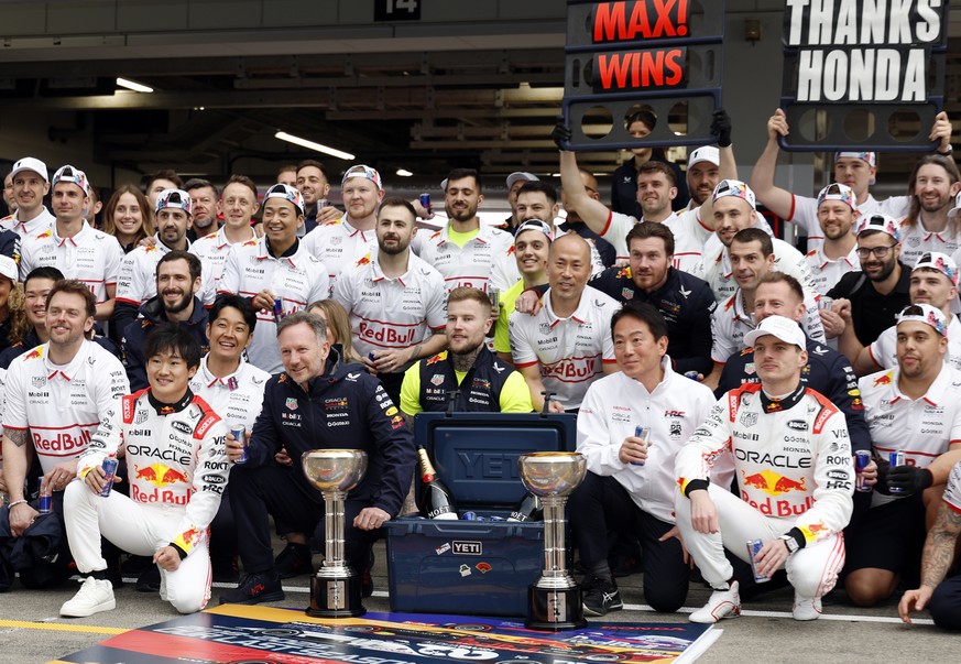 epa12013191 (Front row) Red Bull Racing driver Yuki Tsunoda (L) of Japan, Red Bull Racing team principal Christian Horner (2-L) and Red Bull Racing driver Max Verstappen (R) of the Netherlands pose fo ...