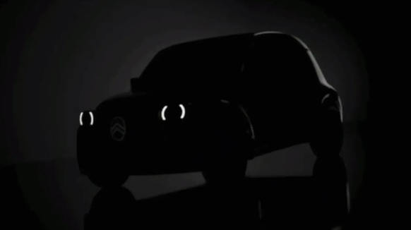 Erste Konturen sind auf dem Teaserbild sichtbar. Es scheint, als würden die hinteren Radausschnitte, anders als beim historischen Vorbild, nicht verdeckt sein.