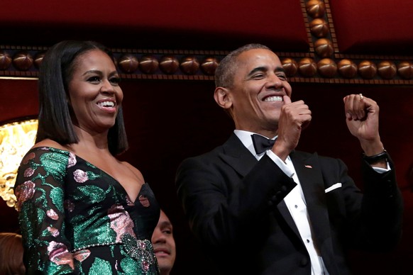 U.S. President Barack Obama gestures as he and first lady Michelle Obama attend the Kennedy Center Honors in Washington, U.S., December 4, 2016. REUTERS/Yuri Gripas