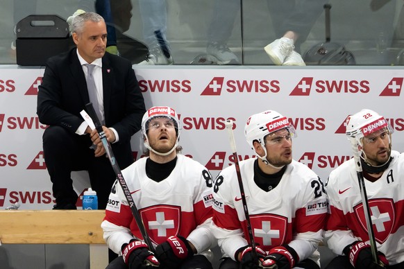 Jan Cadieux, head coach of Switzerland, Switzerland's Christoph Bertschy, Switzerland's Timo Meier and Switzerland's Nino Niederreiter during the 2026 IIHF Men's Ice Hockey World C ...