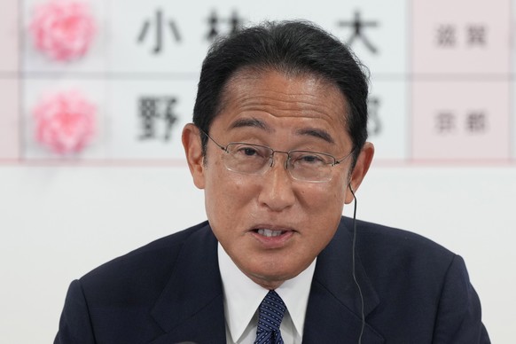 epa10063695 Japan&#039;s prime minister and president of the Liberal Democratic Party (LDP), Fumio Kishida speaks after placing a red paper rose on an LDP candidate&#039;s name, to indicate a victory  ...