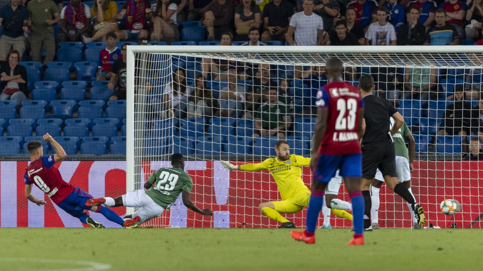 Basel&#039;s Ricky van Wolfswinkel, left, scores during the UEFA Champions League second qualifying round second leg match between Switzerland&#039;s FC Basel 1893 and Netherland&#039;s PSV Eindhoven  ...