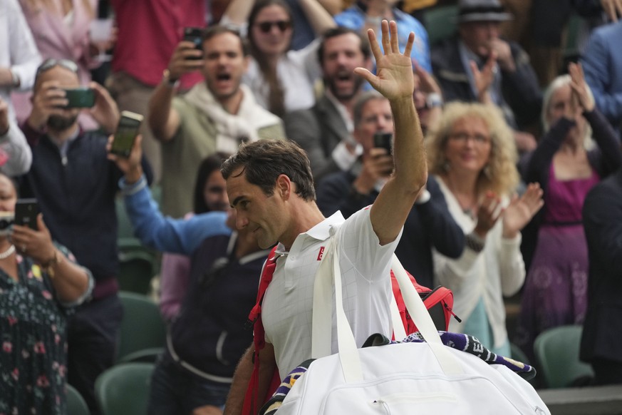 Switzerland&#039;s Roger Federer leaves the court after being defeated by Poland&#039;s Hubert Hurkacz during the men&#039;s singles quarterfinals match on day nine of the Wimbledon Tennis Championshi ...