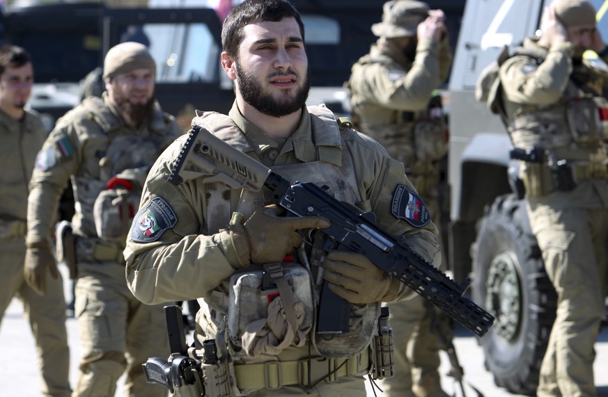 Servicemen listen as Ramzan Kadyrov, leader of the Russian province of Chechnya, speaks to about 10,000 troops in Chechnya&#039;s regional capital of Grozny, Russia, Tuesday, March 29, 2022. (AP Photo ...