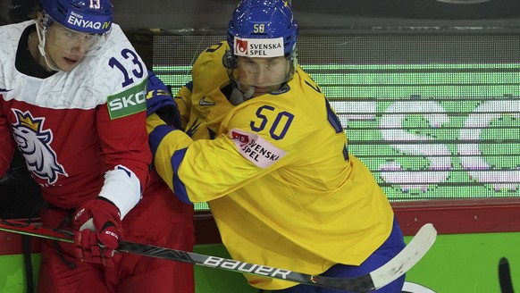 Viktor Loov of Sweden, right, fight for a puck with Jakub Vrana of Czech Republic during the Ice Hockey World Championship group A match between Sweden and Czech Republic at the Olympic Sports Center  ...