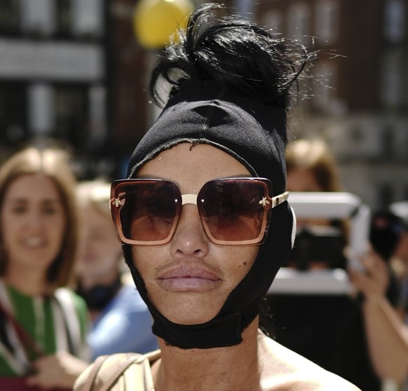 Former glamour model Katie Price arrives at the Royal Courts of Justice in central London, England, Friday August 9, 2024. (Aaron Chown/PA via AP)