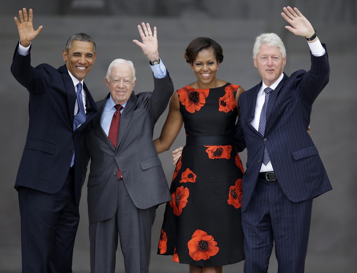 FILE - From left, President Barack Obama, former President Jimmy Carter, first lady Michelle Obama and former President Bill Clinton wave to the crowd from the steps of the Lincoln Memorial in Washing ...