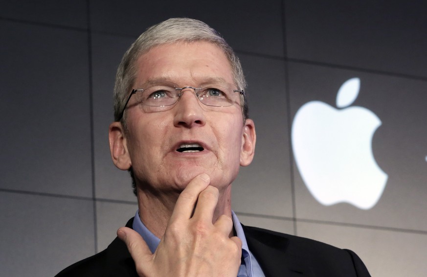 FILE - In this April 30, 2015 file photo, Apple CEO Tim Cook responds to a question during a news conference at IBM Watson headquarters, in New York. Apple CEO Tim Cook laid out his companys plans fo ...