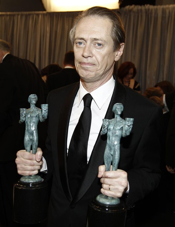 Steve Buscemi poses backstage with the awards for outstanding performance by a male actor in a drama series and outstanding performance by an ensemble in a drama series for &quot;Boardwalk Empire&quot ...