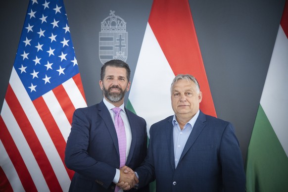epa11407903 A handout photo made available by the Hungarian PM&#039;s Press Office, shows Hungarian Prime Minister Viktor Orban (R) receives US businessman and son of former US president, Donald Trump ...