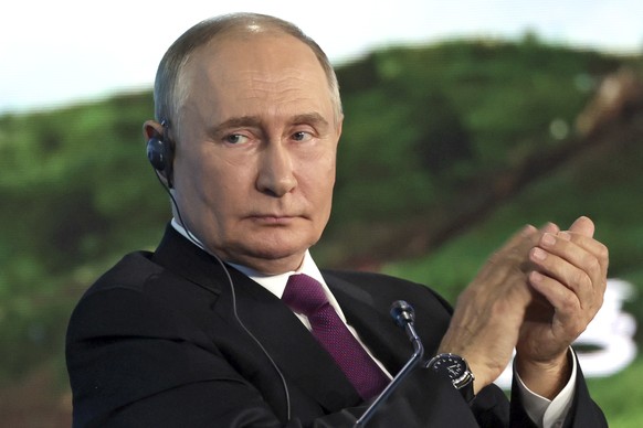 Russian President Vladimir Putin applauds during the plenary session of the Eastern Economic Forum in Vladivostok, Russia, Thursday, Sept. 5, 2024. (Vyacheslav Prokofyev, Sputnik, Kremlin Pool Photo v ...