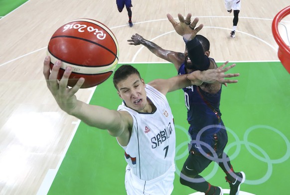 2016 Rio Olympics - Basketball - Final - Men's Gold Medal Game Serbia v USA - Carioca Arena 1 - Rio de Janeiro, Brazil - 21/8/2016. Bogdan Bogdanovic (SRB) of Serbia shoots past Kyrie Irving (USA) of the USA. REUTERS/Elsa/Pool FOR EDITORIAL USE ONLY. NOT FOR SALE FOR MARKETING OR ADVERTISING CAMPAIGNS.