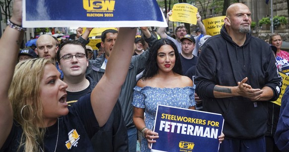 Supporters surround John Fetterman, right, Pennsylvania&#039;s Democratic lieutenant governor and senate candidate, during a Labor Day parade in downtown Pittsburgh, on Monday, Sept. 5, 2022. His wife ...