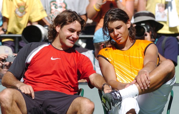 Roger Federer, left, of Switzerland and Rafael Nadal of Spain have a light moment after the men&#039;s singles final at the Nasdaq 100 Open, Sunday, April 3, 2005 at Key Biscayne, Fla. Federer won 2-6 ...