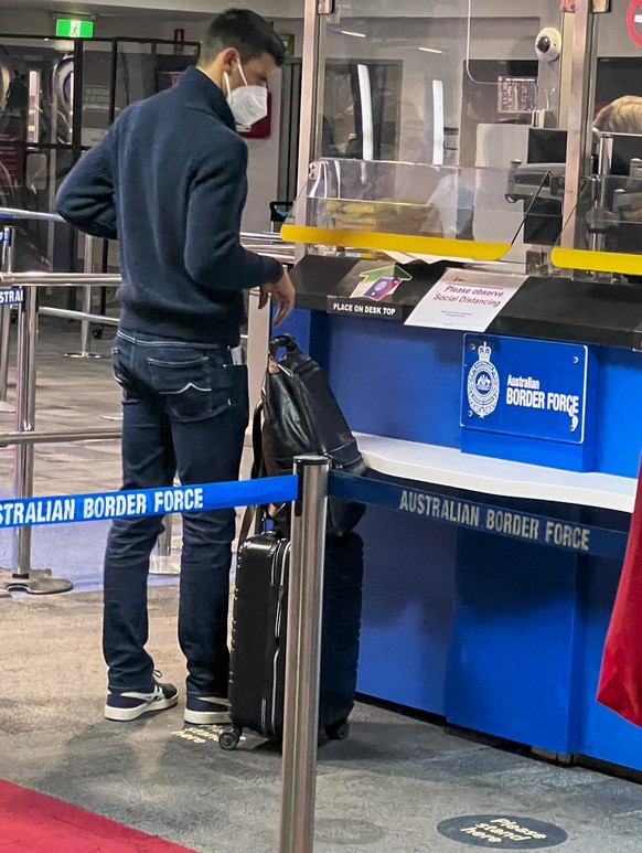 Serbia&#039;s Novak Djokovic, the Australian Open defending champion, waits at an Australian Border Force desk on his arrival at Melbourne Airport, Wednesday, Jan. 5, 2022. Locked in a dispute over hi ...