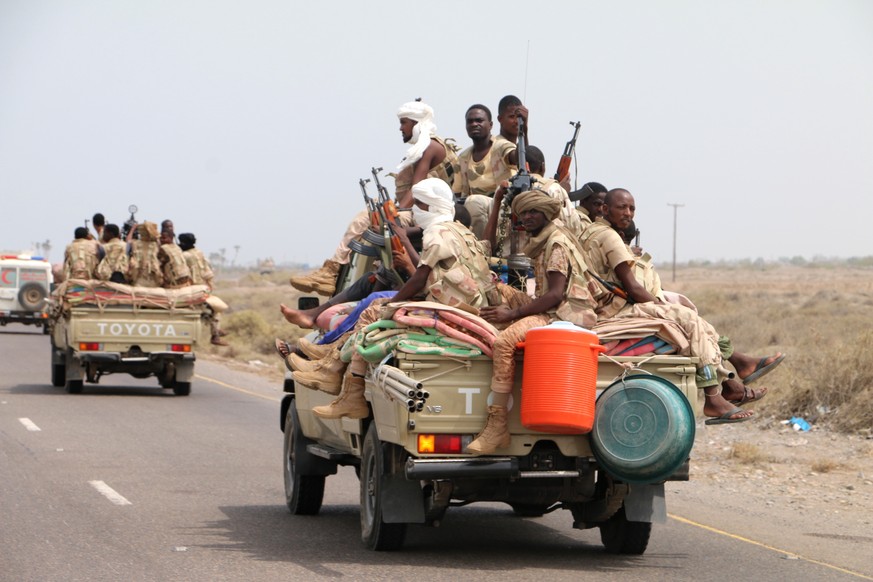 epa06802967 Sudanese forces fighting alongside the Saudi-led coalition in Yemen gather near the outskirts of the western port city of Hodeidah, Yemen, 12 June 2018. According to reports, the Saudi-led ...