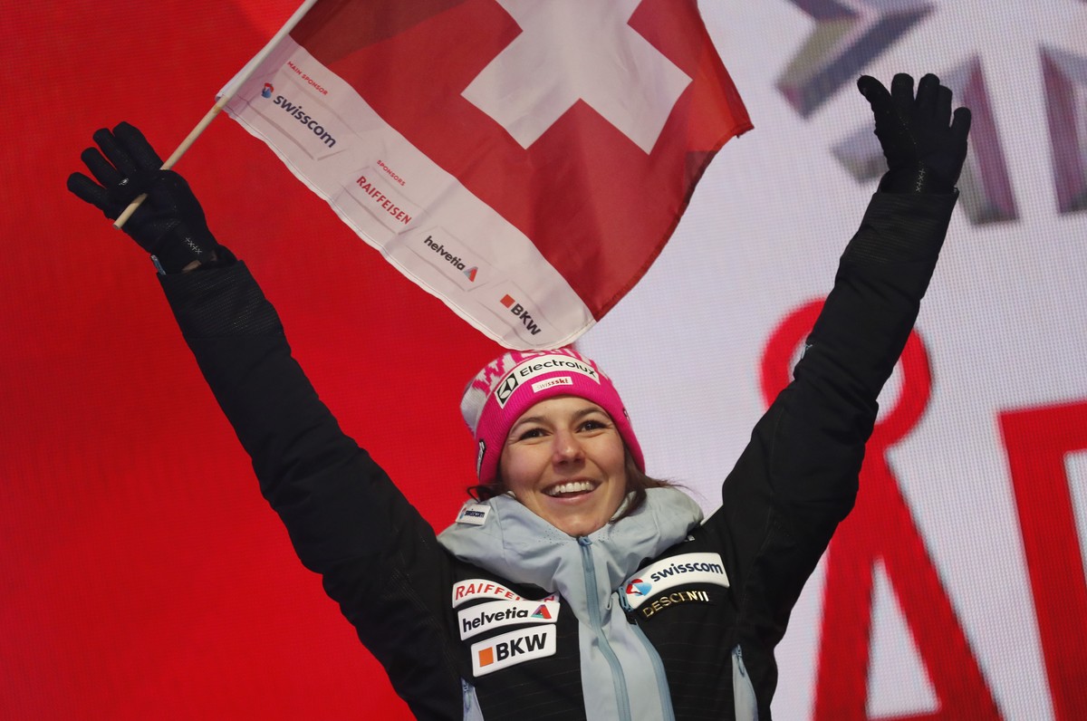 Switzerland's Wendy Holdener waves her national flag during the medal ceremony for the women's combined race, at the alpine ski World Championships in Are, Sweden, Friday, Feb. 8, 2019. (AP  ...