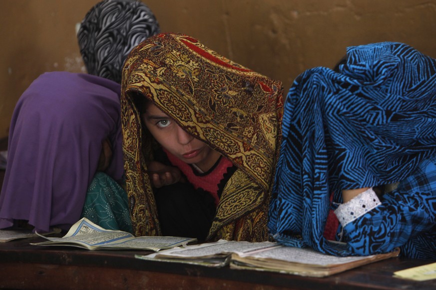 Pakistani Muslim children study the Quran at a religious school in Karachi, Pakistan, Wednesday, Feb. 1, 2017. (AP Photo/Fareed Khan)