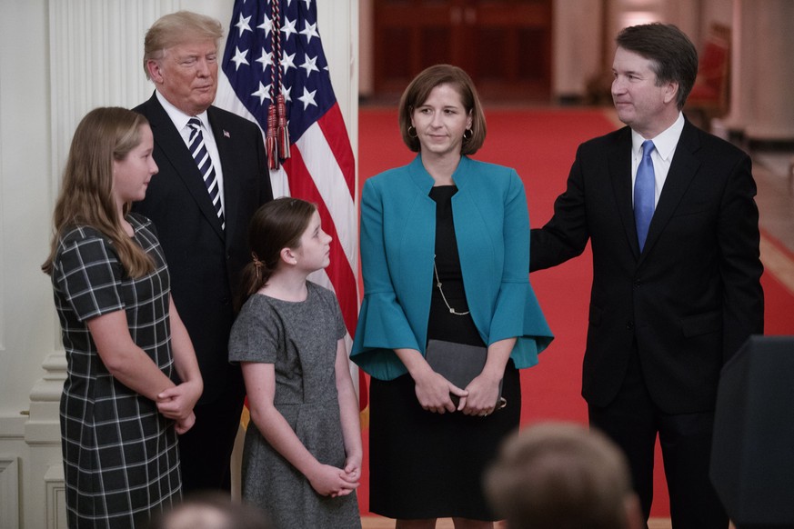 epa07079749 Supreme Court Associate Justice Brett Kavanaugh (R), with his wife Ashley Kavanaugh (4-L), Daughters Liza and Margaret Kavanaugh and US President Donald J. Trump (2-L), after being ceremon ...