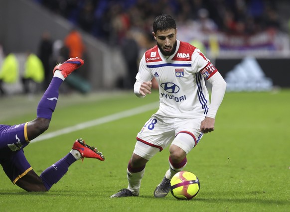 Lyon forward Nabil Fekir controls the ball during the French League One soccer match between Lyon and Toulouse, in Decines, near Lyon, central France, Sunday, March 3, 2019. (AP Photo/Laurent Cipriani ...