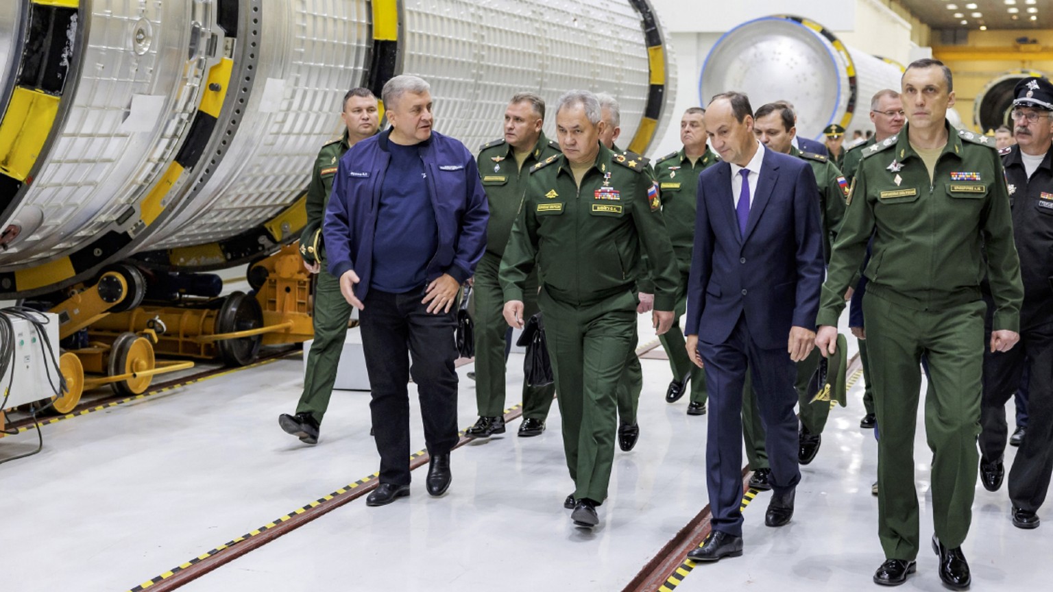 In this photo released by Russian Defense Ministry Press Service on Saturday, Oct. 7, 2023, The Russian Defense Minister Sergei Shoigu, center, inspects fulfilment of the state defense order at the Kr ...