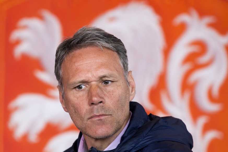 FILE - In this Friday, May 20, 2016 file photo, Dutch former soccer star Marco van Basten is seated in front of the logo of the Dutch soccer association KNVB during a presentation of video referee ass ...