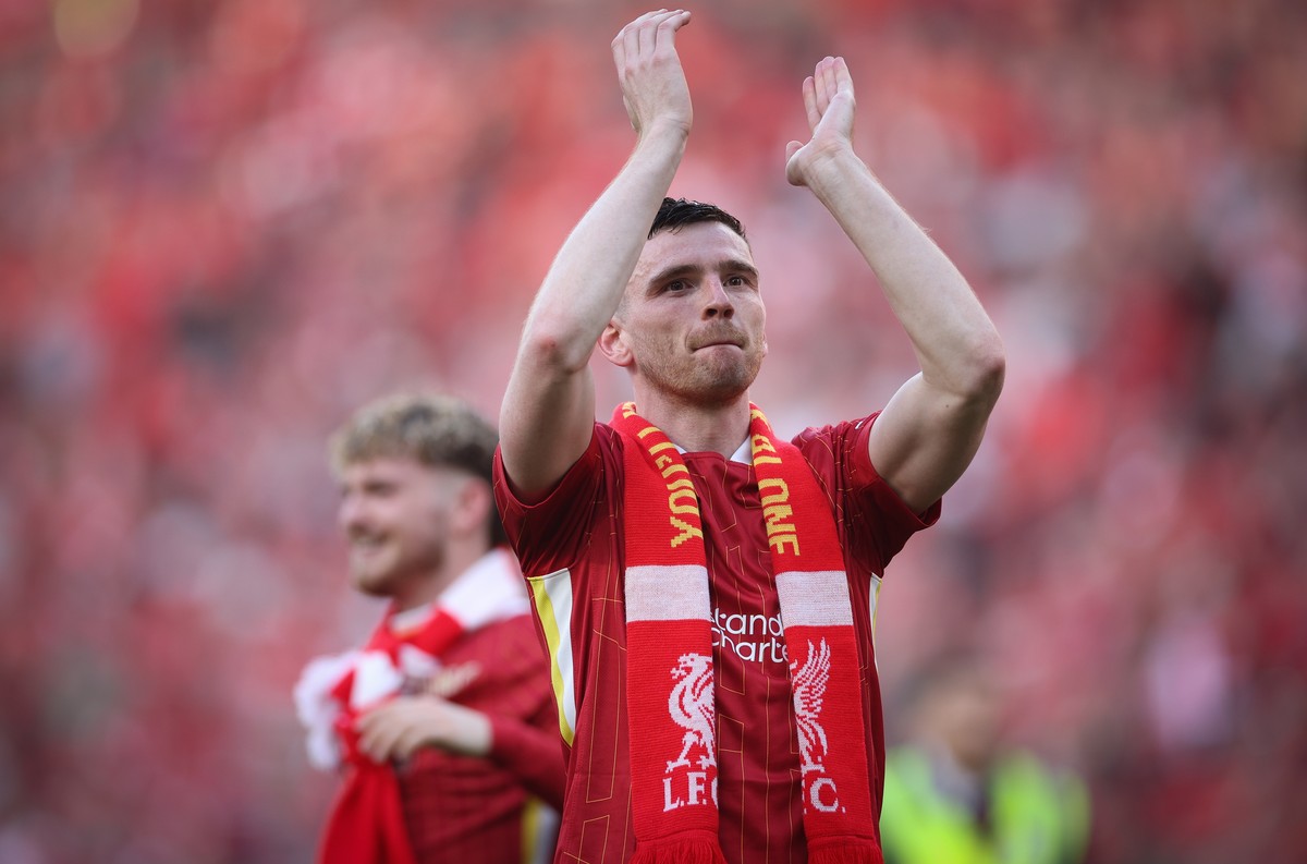 epa12059477 Andrew Robertson of Liverpool celebrates winning the Premier League title after the English Premier League soccer match between Liverpool FC and Tottenham Hotspur, in Liverpool, Britain, 2 ...
