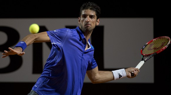 Thomaz Bellucci, of Brazil, returns the ball to Novak Djokovic, of Serbia, during their match at the Italian Open tennis tournament, in Rome, Thursday, May 14, 2015. (AP Photo/Andrew Medichini)