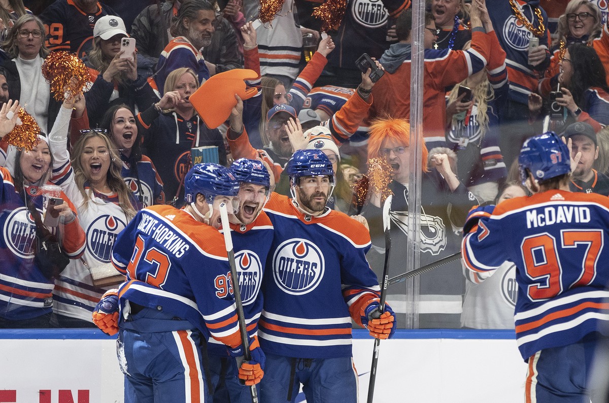 Edmonton Oilers' Ryan Nugent-Hopkins (93), Zach Hyman (18), Evan Bouchard (2) and Connor McDavid (97) celebrate a goal against the Vancouver Canucks during the second period of Game 6 of an NHL h ...