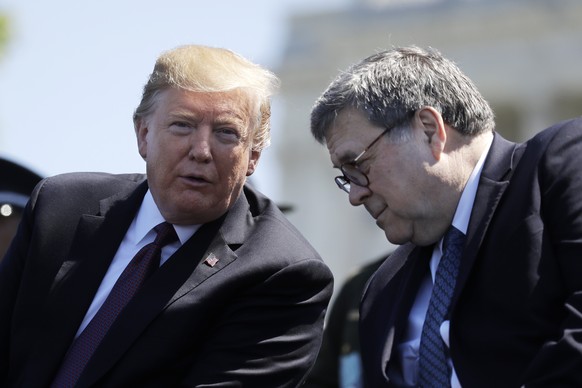 FILE - In this May 15, 2019, file photo, President Donald Trump and Attorney General William Barr speak at the 38th Annual National Peace Officers&#039; Memorial Service at the U.S. Capitol in Washing ...