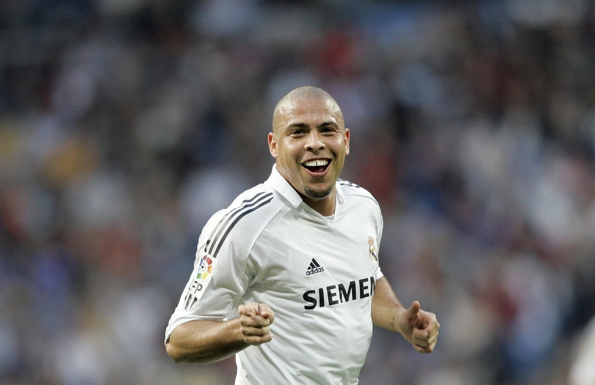 Real Madrid Brazilian player Ronaldo celebrates after scoring his goal number one hundred, as Real Madrid player, during a Spanish league soccer match at the Santiago Bernabeu stadium in Madrid, Spain ...