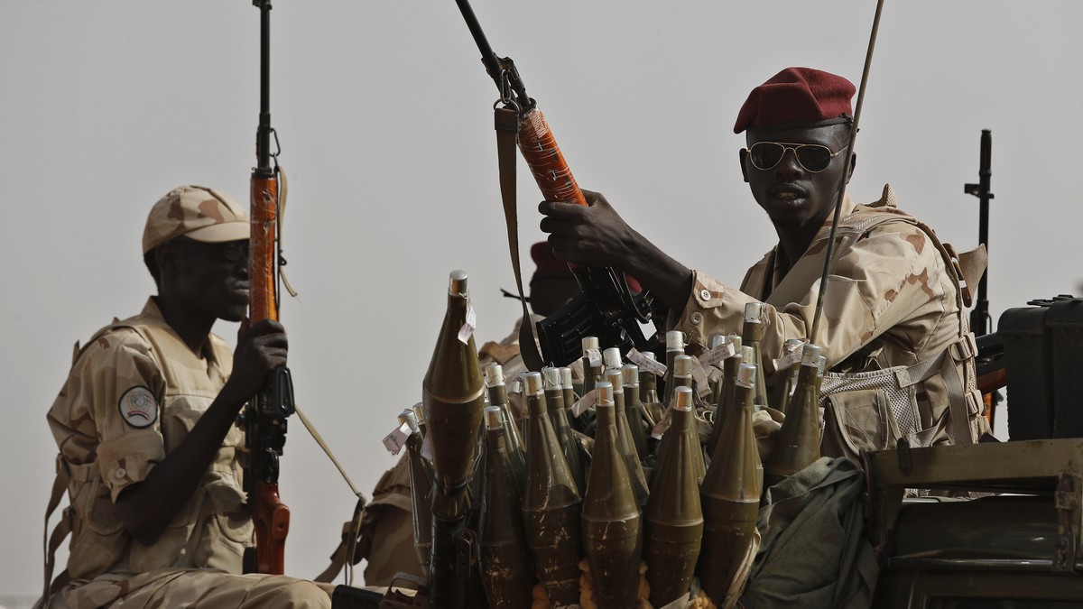 FILE - Sudanese soldiers from the Rapid Support Forces unit, led by Gen. Mohammed Hamdan Dagalo, the deputy head of the military council, secure the area where Dagalo attends a military-backed tribe&# ...