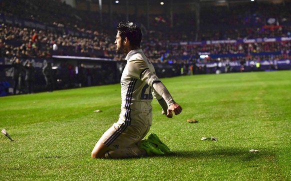 Real Madrid&#039;s Isco cerebrates his goal after scoring against Osasuna during the Spanish La Liga soccer match between Real Madrid and Osasuna, at El Sadar stadium, in Pamplona, northern Spain, Sat ...