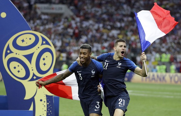France's Presnel Kimpembe and Lucas Hernandez celebrate after the final match between France and Croatia at the 2018 soccer World Cup in the Luzhniki Stadium in Moscow, Russia, Sunday, July 15, 2018.  ...