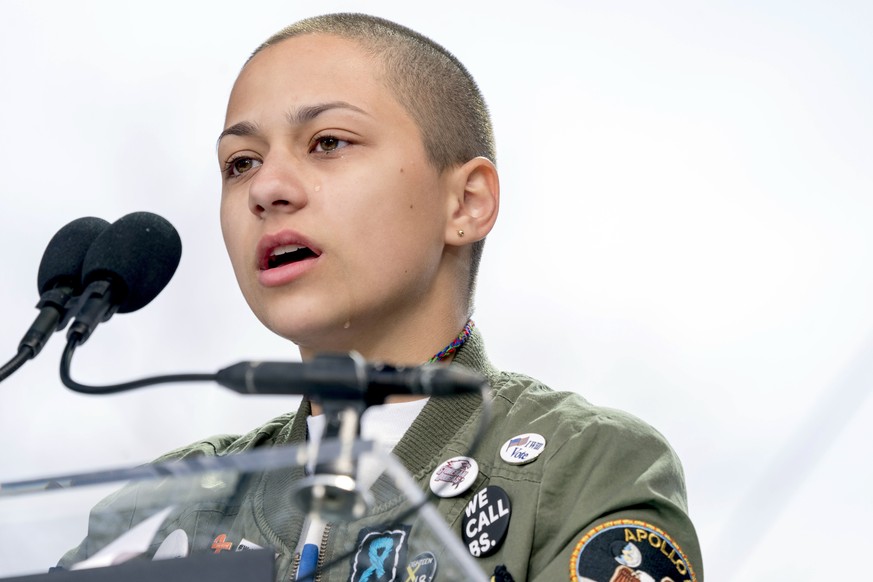 FILE -- In this March 24, 2018 file photo, Emma Gonzalez, a survivor of the mass shooting at Marjory Stoneman Douglas High School in Parkland, Fla., closes her eyes and cries as she stands silently at ...